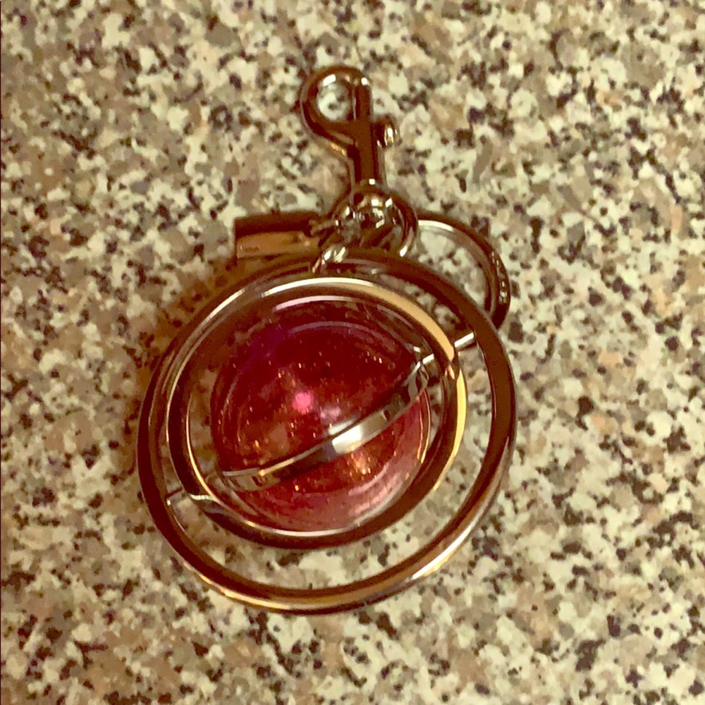 Saturnesque pink and silver Coach purse charm